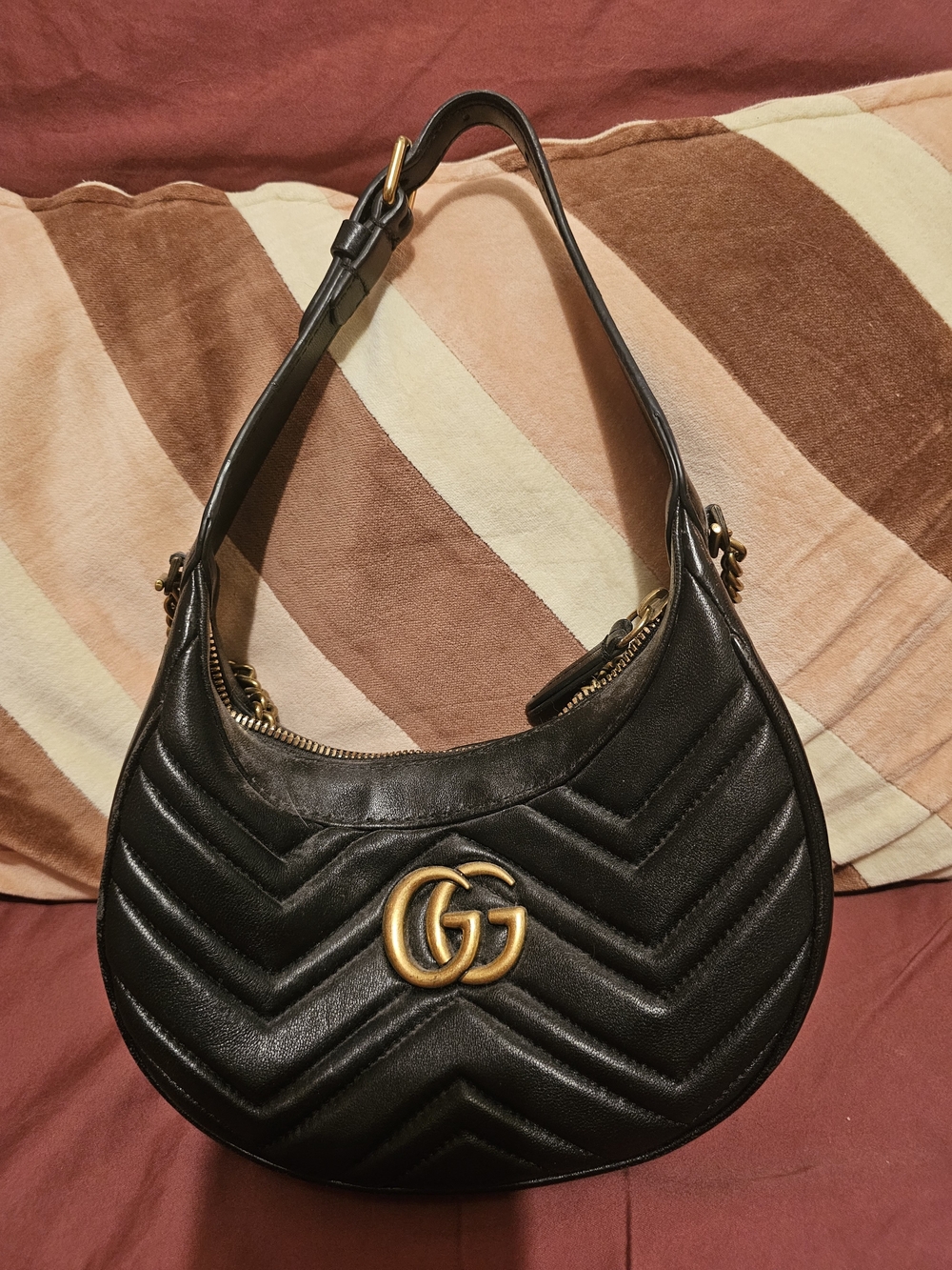 Black Quilted Crescent Shoulder Bag with Gold Logo Accent